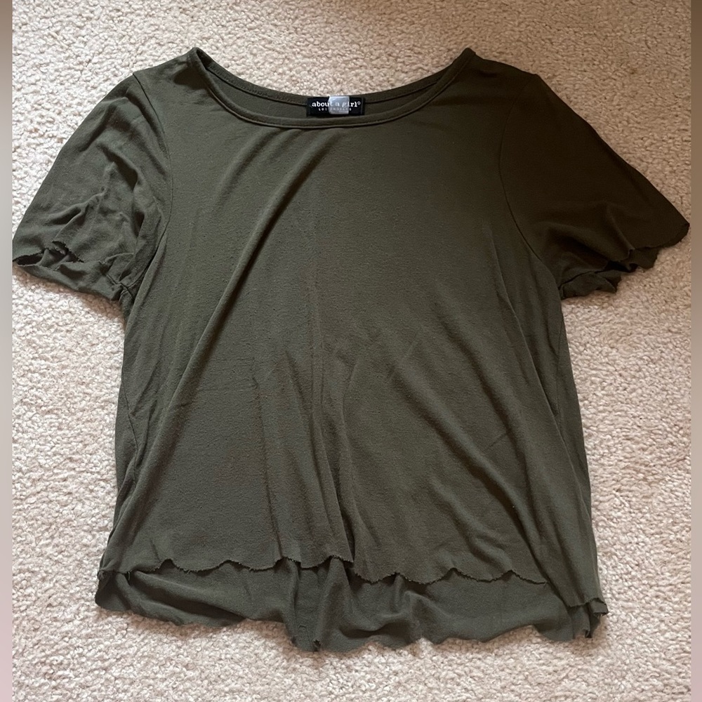 Green kids shirt from the brand About A Girl, never worn